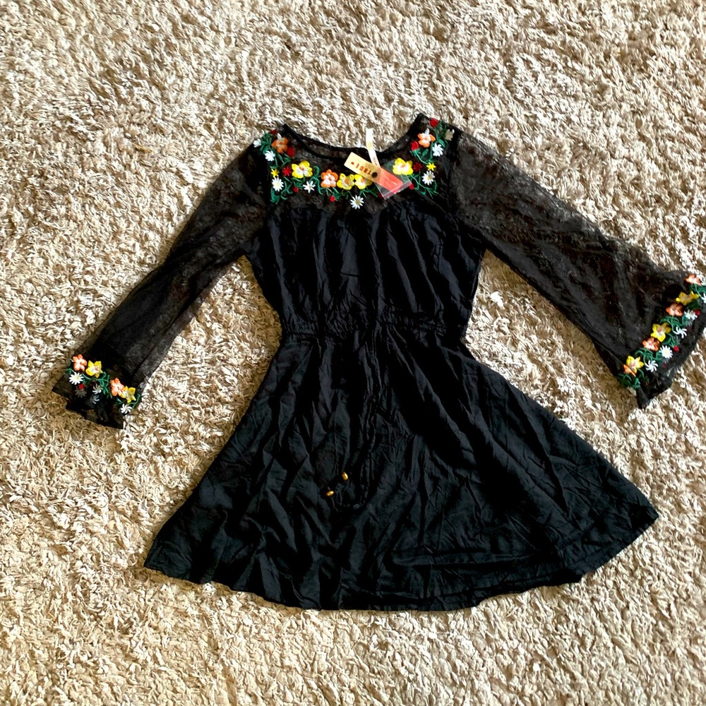 Cute dress. See through arms. Black . Sz M but fits S. New